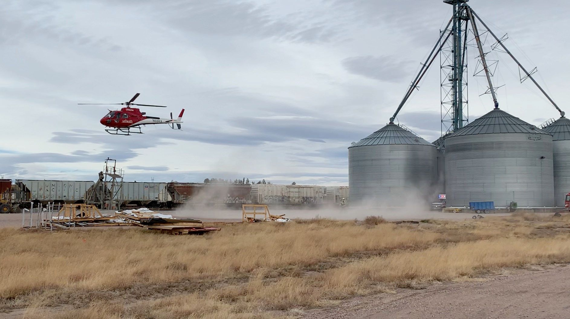 Emergency response officials surround grain bins at Pennington Seed